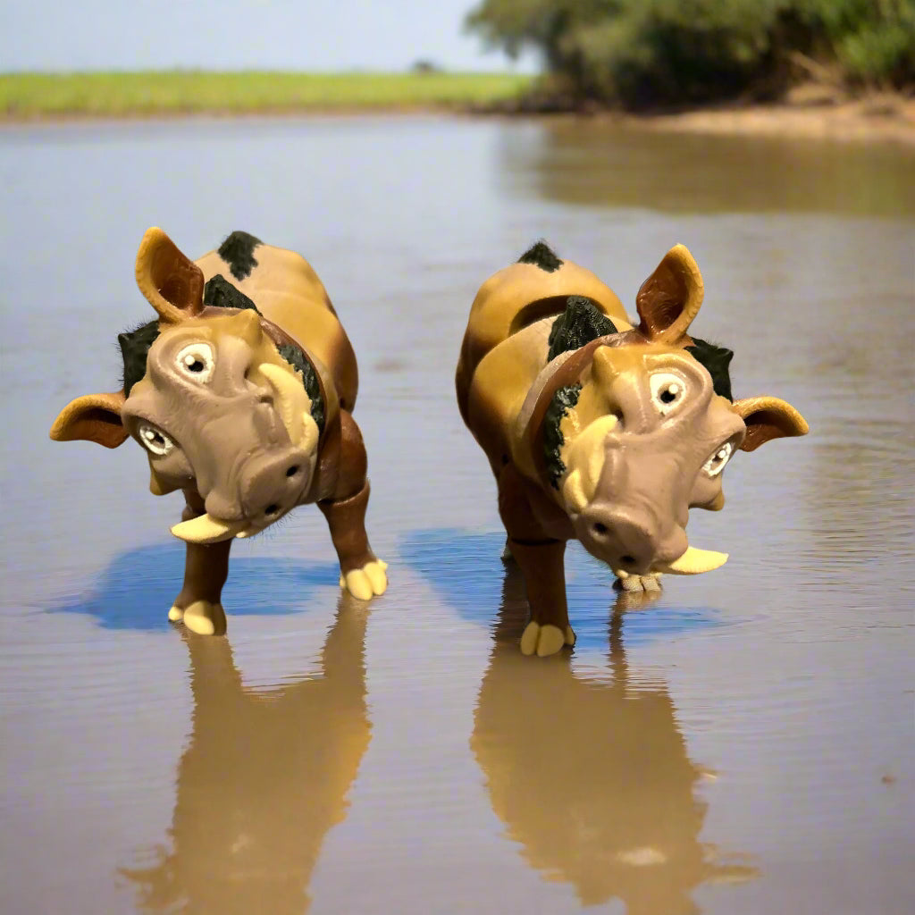 Two warthogs looking goofy