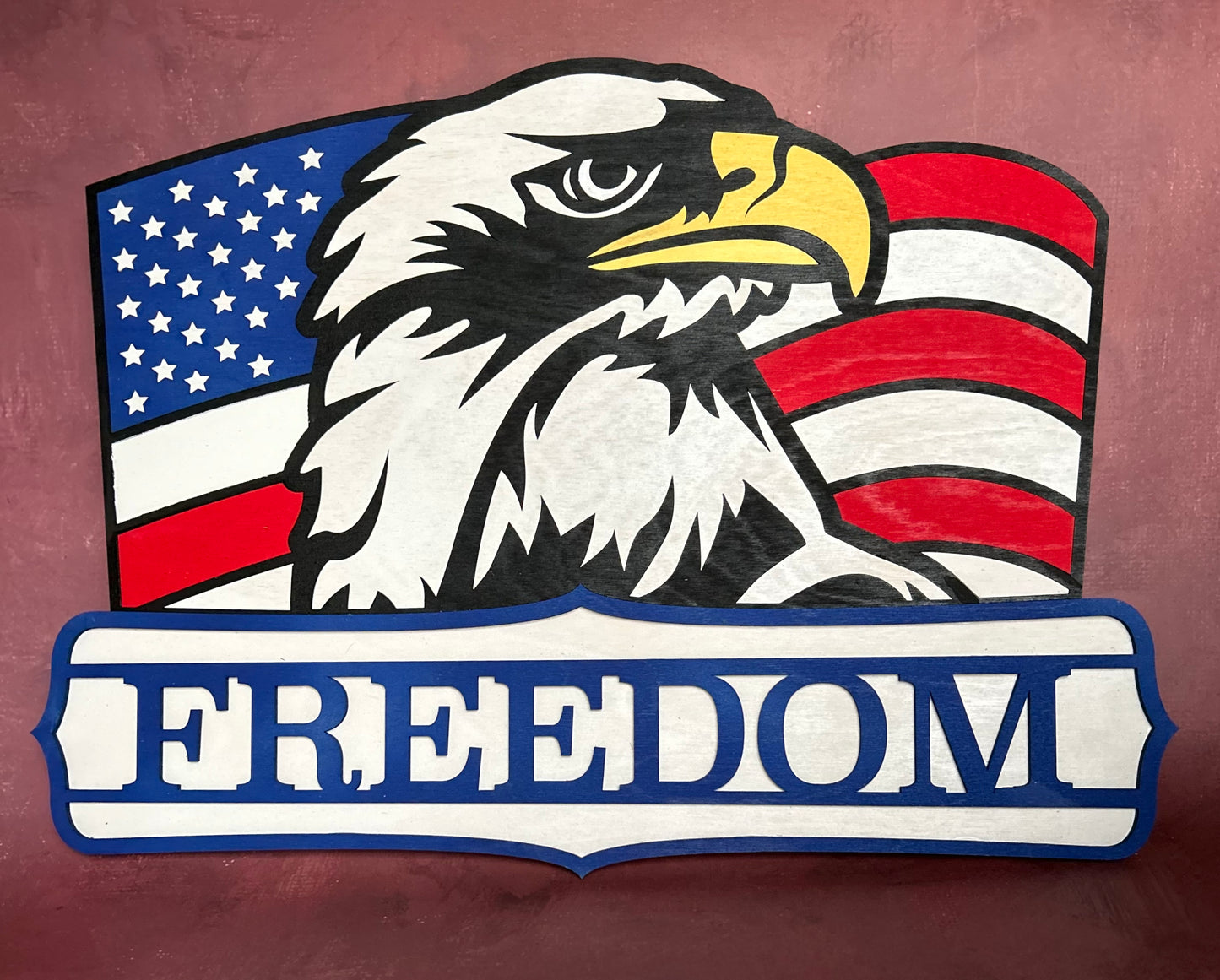 American Eagle with USA Flag background and "Freedom" text with maroon background 