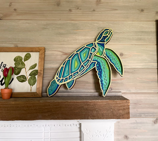 Colorful Sea Turtle, multi-layer, laser cut on fireplace mantel
