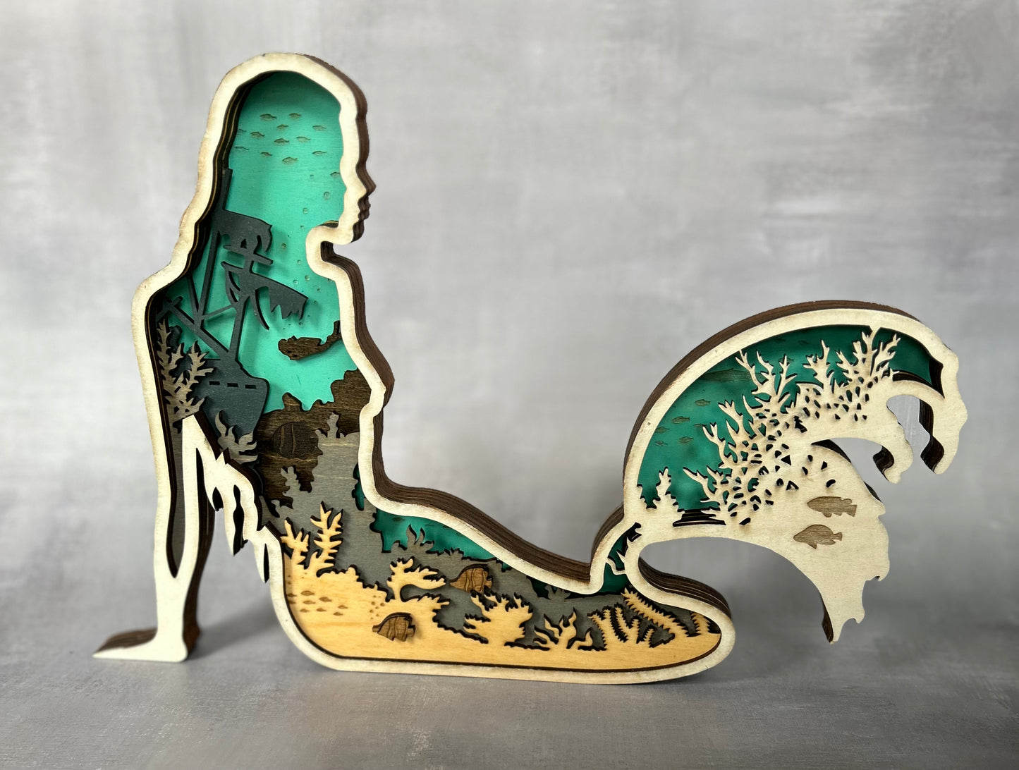 Mermaid made with six laser cut layers painted to create an amazing undersea scene.