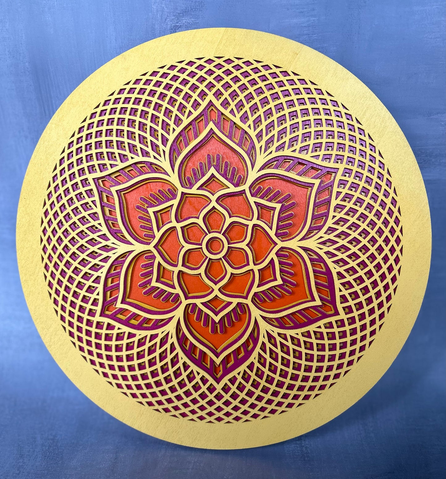 Rosette created with multiple laser cut layers, hand painted in blue and green hues. Also available as unpainted and unassembled.