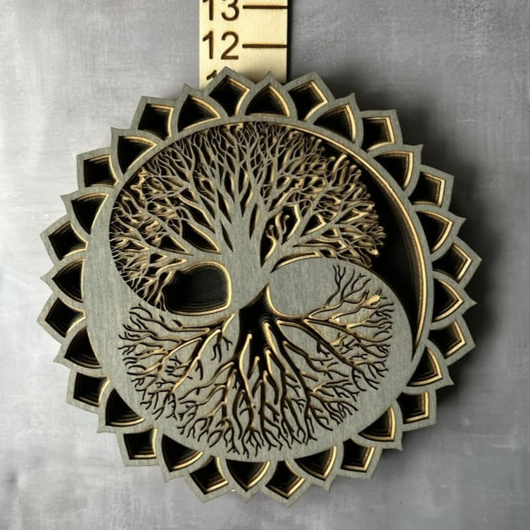 Grey, tan and black tree of life on a grey background with measurements 