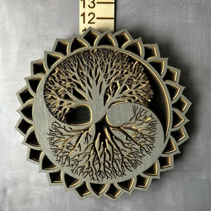 Grey, tan and black tree of life on a grey background with measurements 