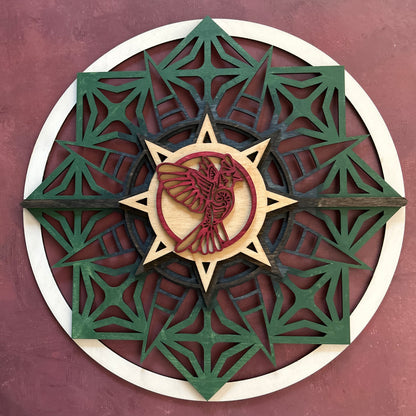 Sun style round, stained with Earth tones and a red bird with a maroon background