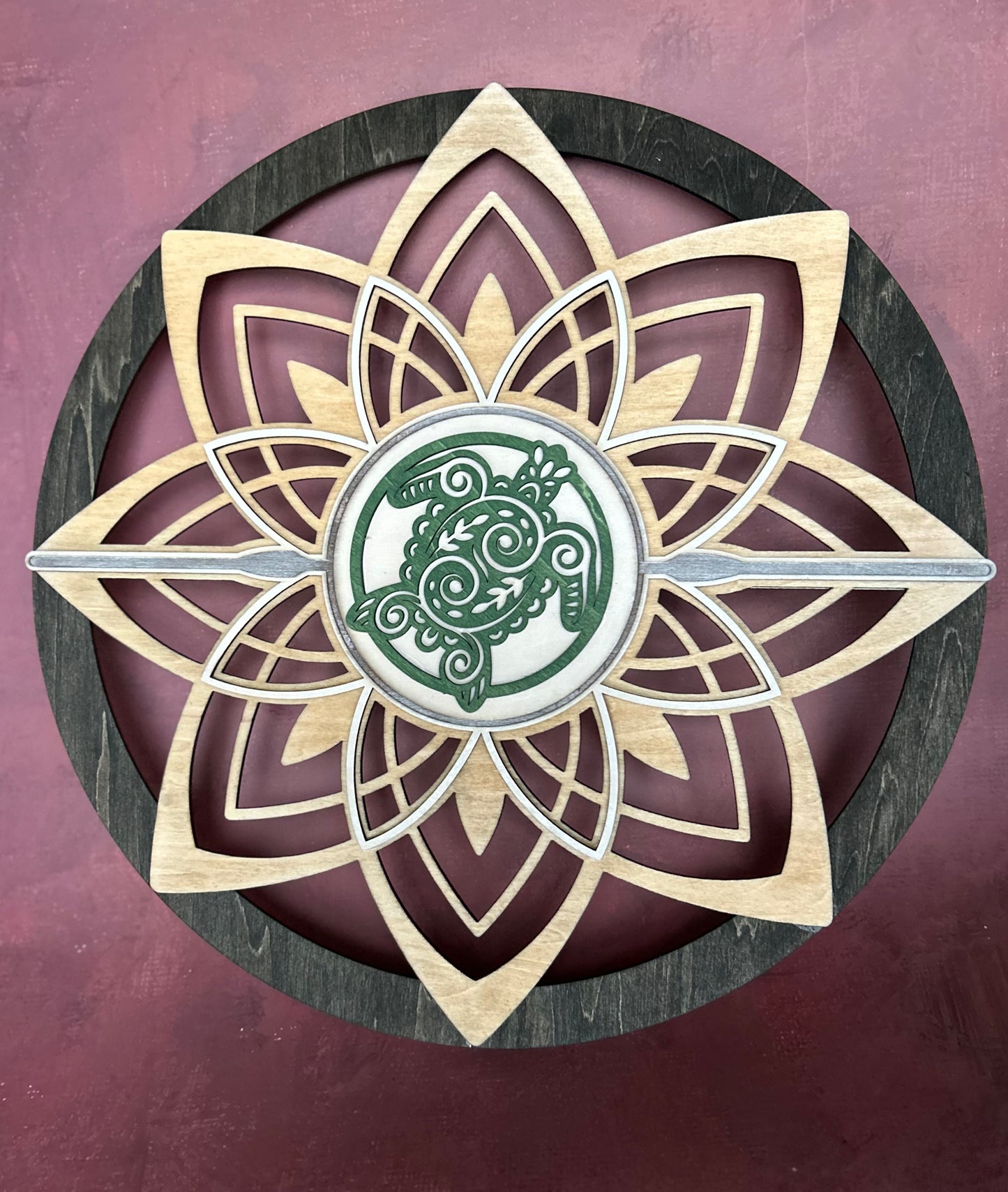 Round flower wall art with sea turtle with maroon background