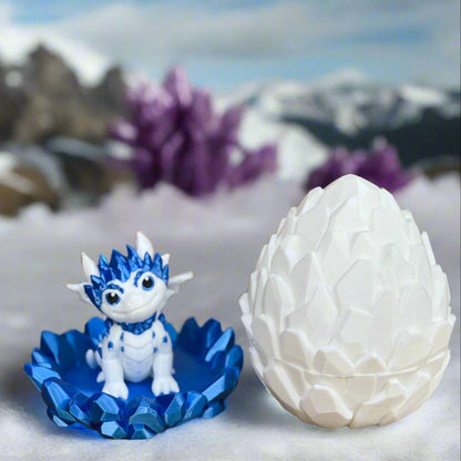 Blue and white dragon figurine with a matching egg on a wooden surface