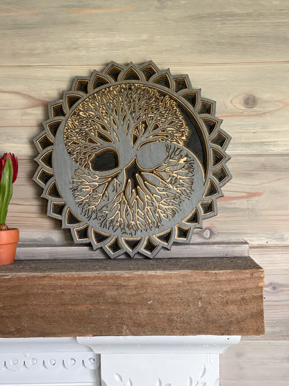 Grey, tan and black tree of life on a mantel