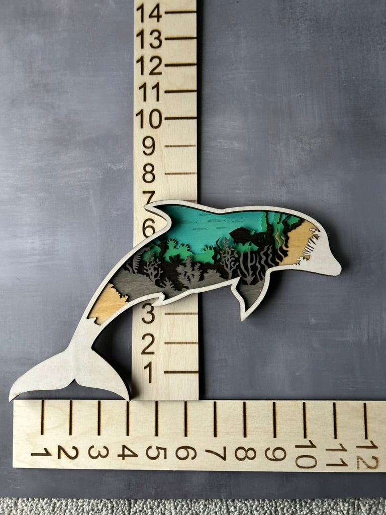 Dolphin made with six laser cut layers painted to create an amazing undersea scene.