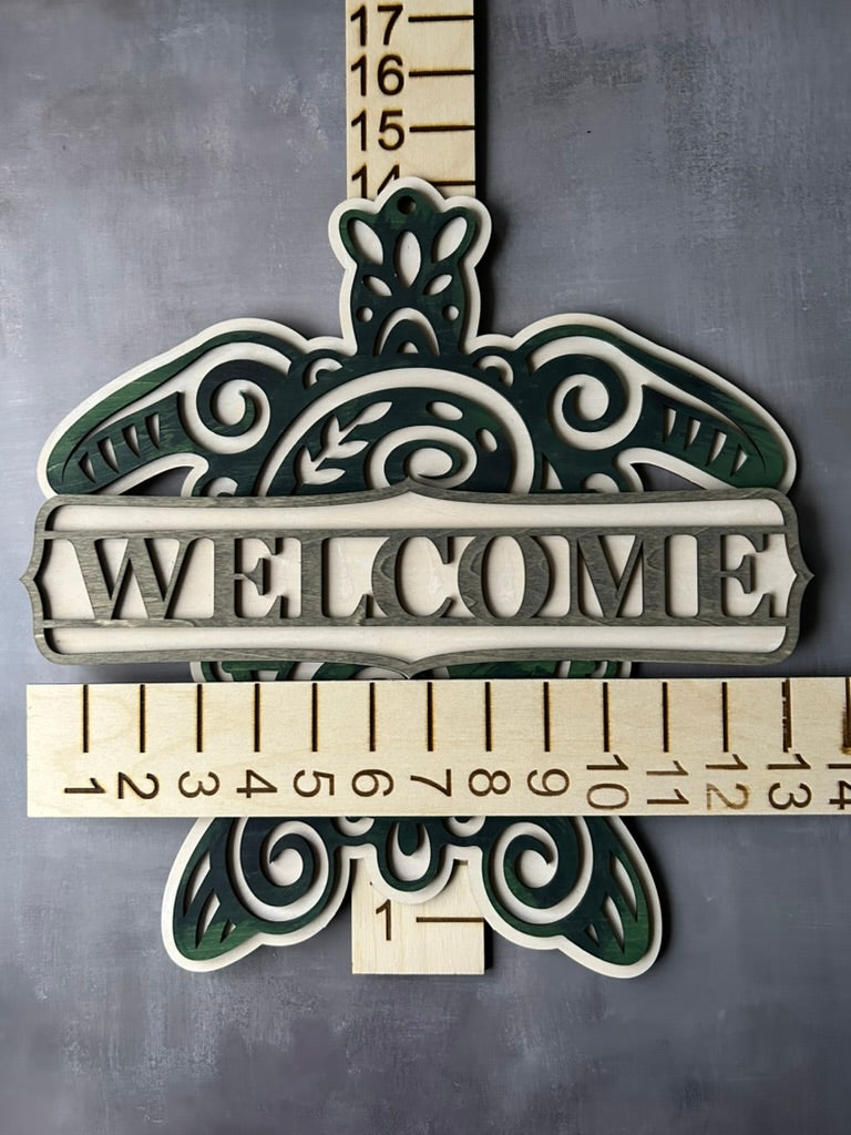 Sea turtle welcome sign stained with blue, green and grey shades with measurements