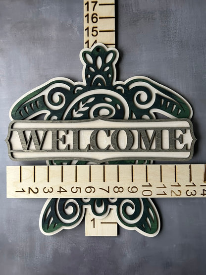 Sea turtle welcome sign stained with blue, green and grey shades with measurements
