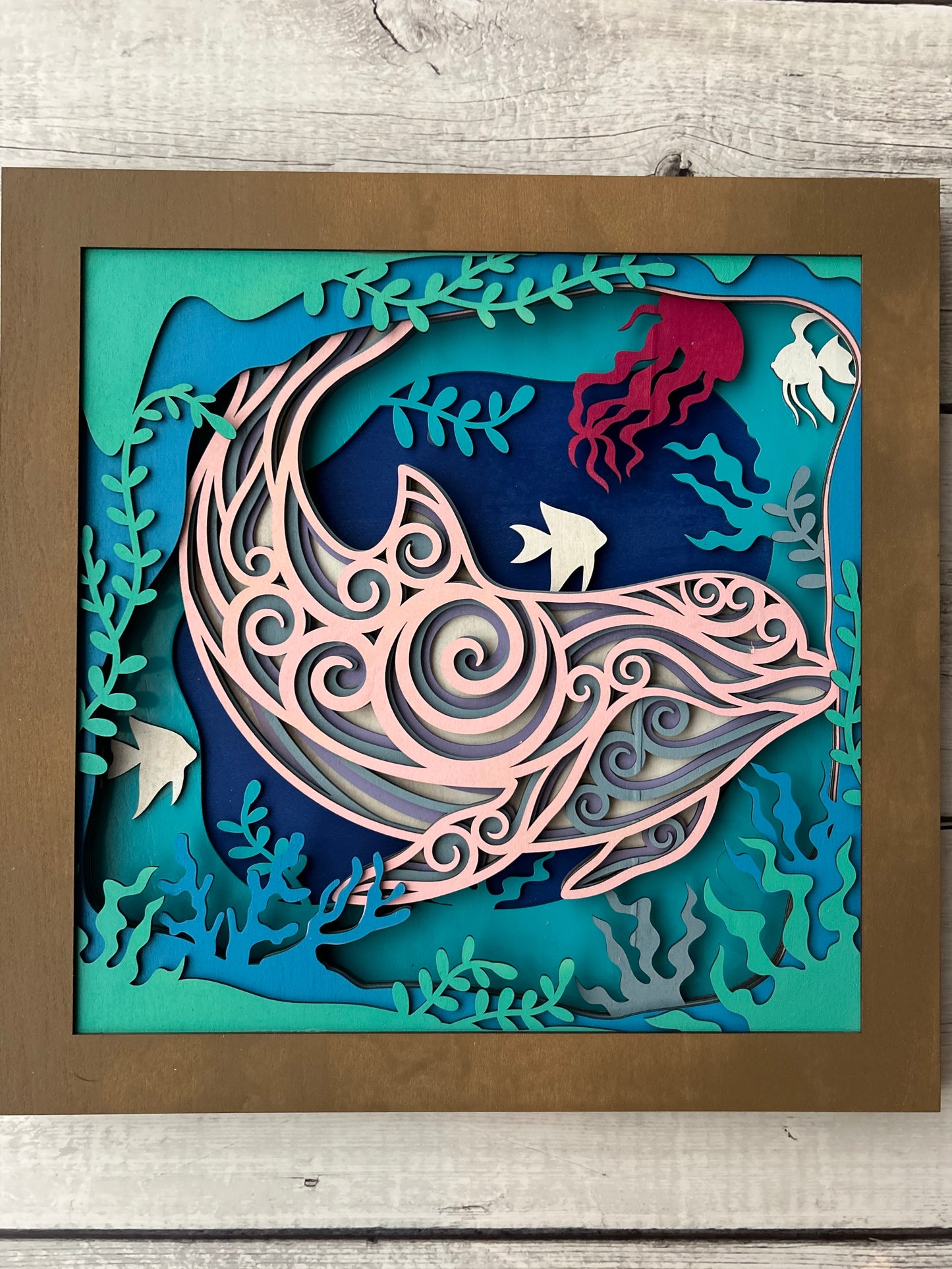 Multi-color, multi-layer laser cut wood dolphin