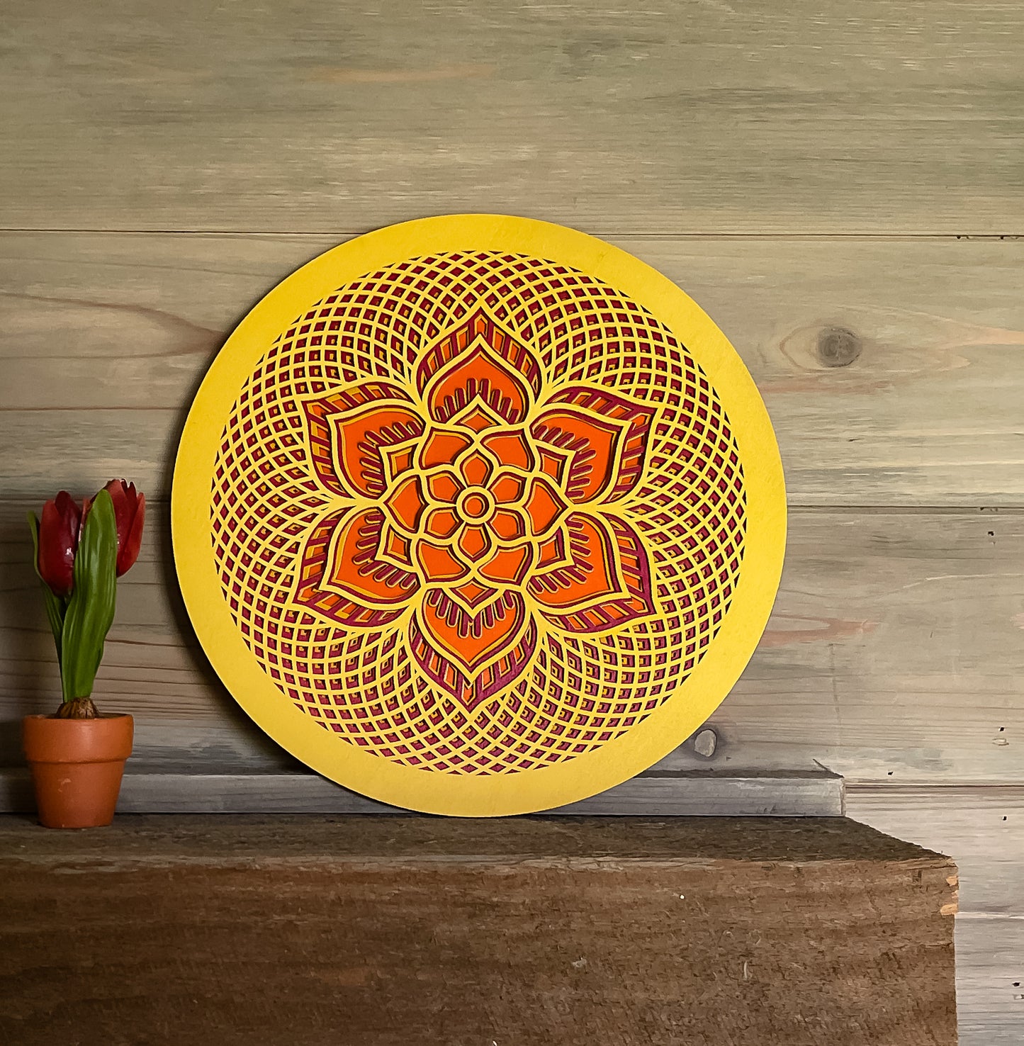 Rosette created with multiple laser cut layers, hand painted in blue and green hues. Also available as unpainted and unassembled.