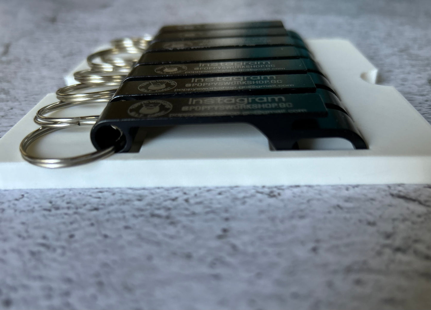 xTool F1 Bottle Opener Jig for up to seven openers. 3d printed specifically for the xTool F1. An xTool XCS layout file is provided as part of the purchase.