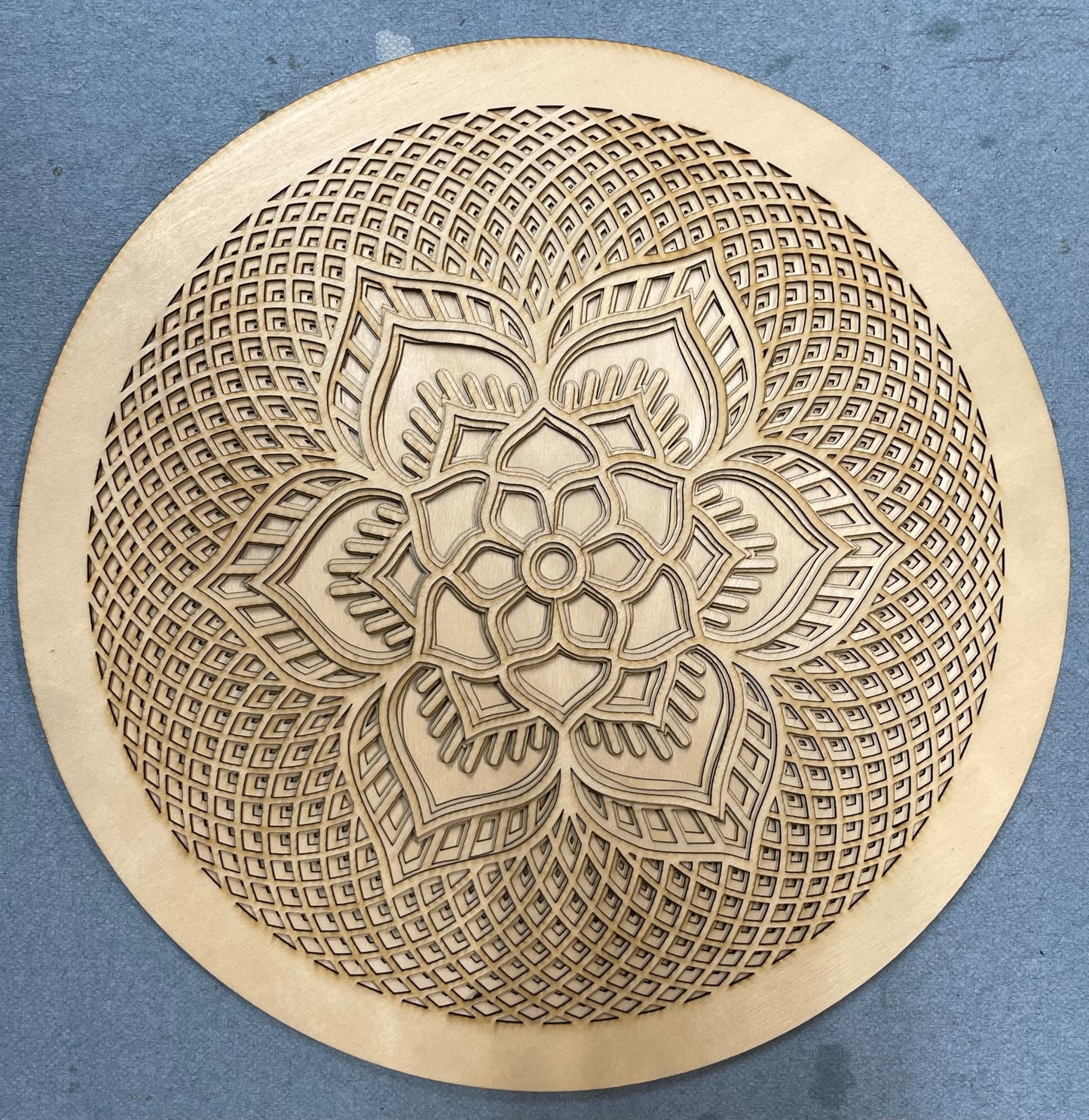 Rosette created with multiple laser cut layers, hand painted in blue and green hues. Also available as unpainted and unassembled.