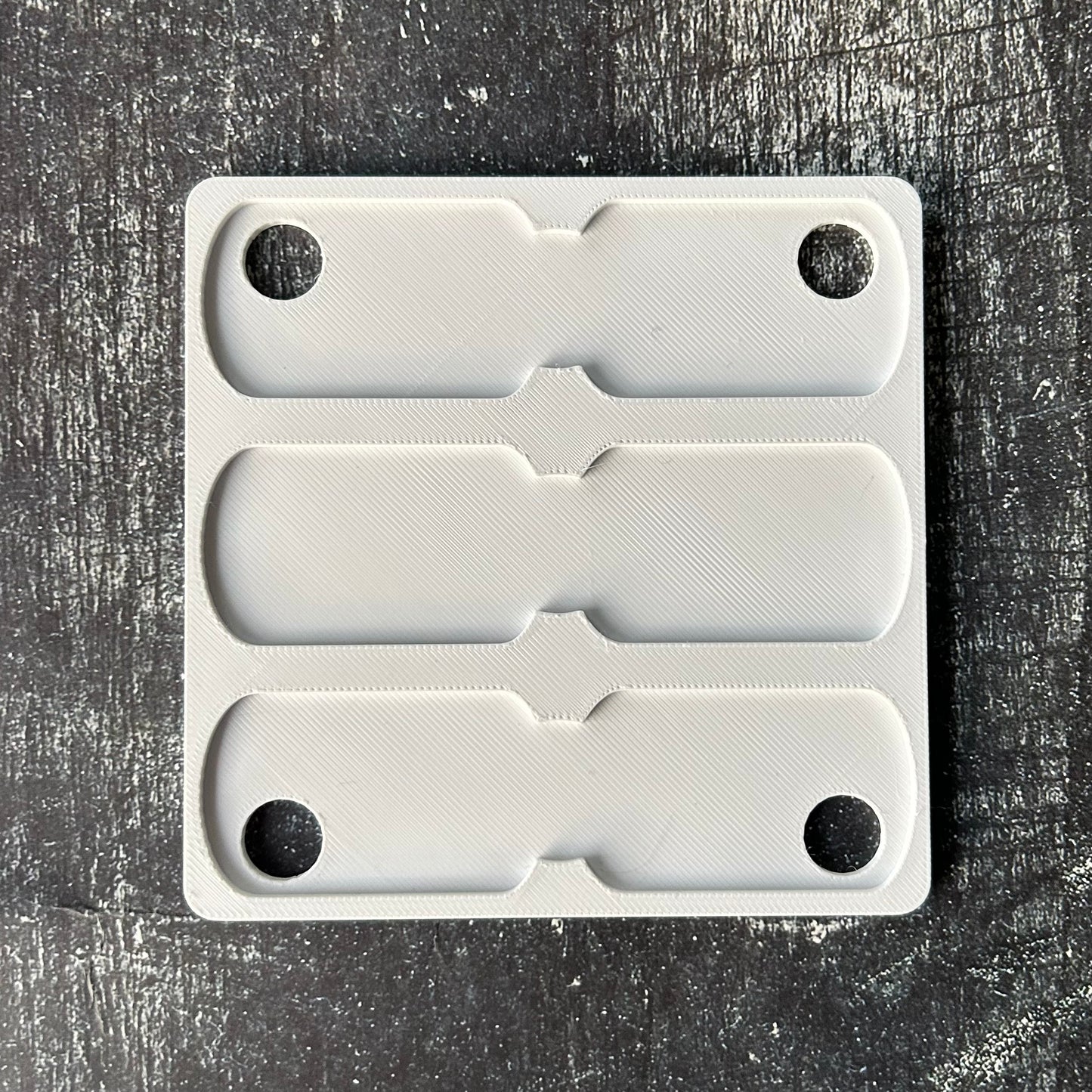 xTool F1 Military Dog Tag jig. 3d printed specifically for the xTool F1. An xTool XCS layout file will be provided.