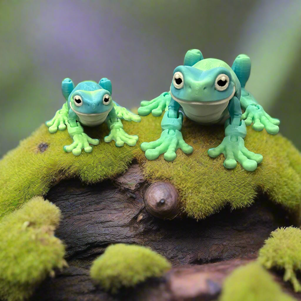 Two tree frogs sitting on a mossy stump