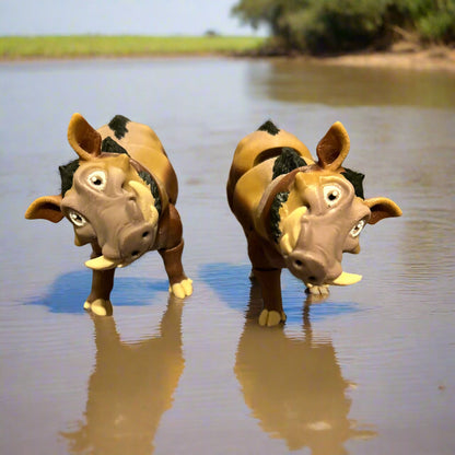 Two warthogs looking goofy