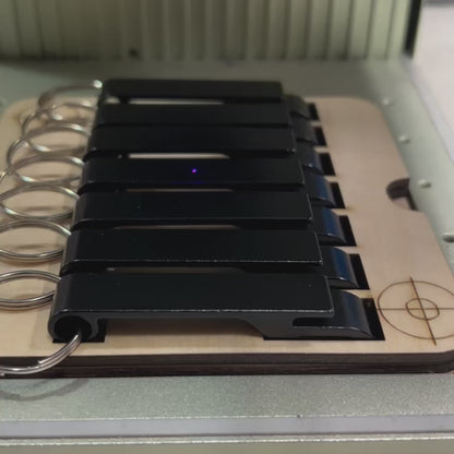 xTool F1 Bottle Opener Jig for up to seven openers. 3d printed specifically for the xTool F1. An xTool XCS layout file is provided as part of the purchase.