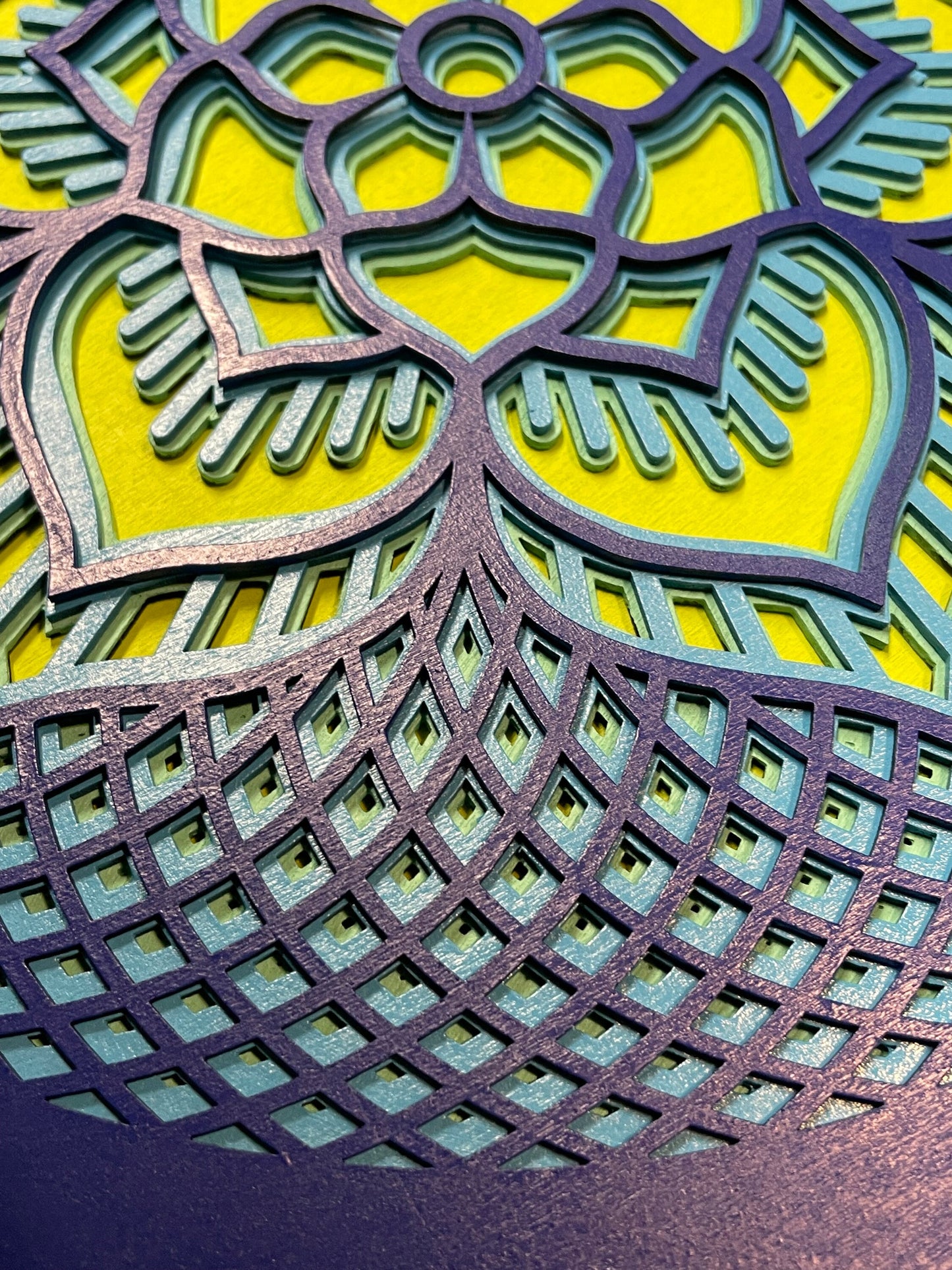 Rosette created with multiple laser cut layers, hand painted in blue and green hues. Also available as unpainted and unassembled.