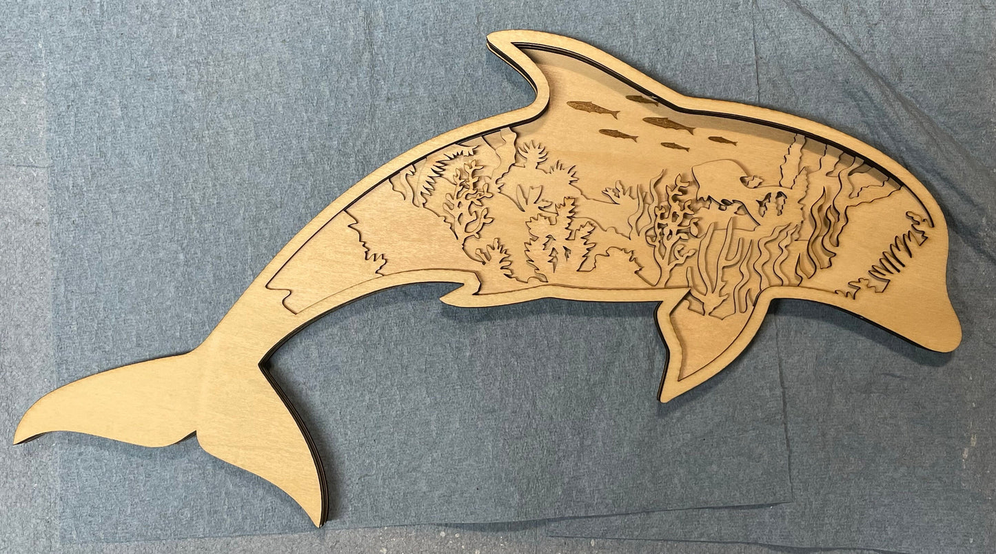 Dolphin made with six laser cut layers painted to create an amazing undersea scene.