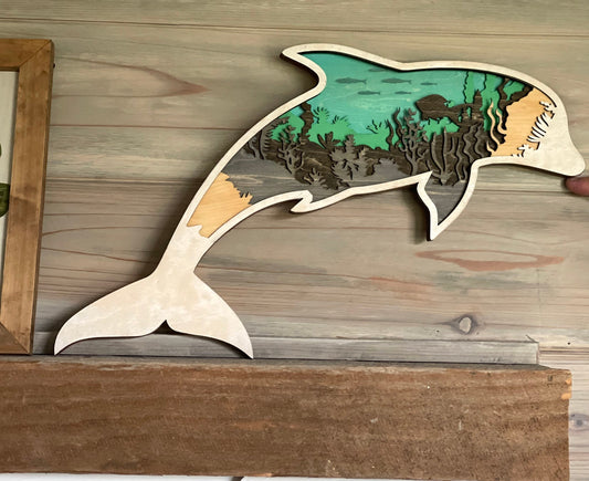 Dolphin made with six laser cut layers painted to create an amazing undersea scene.