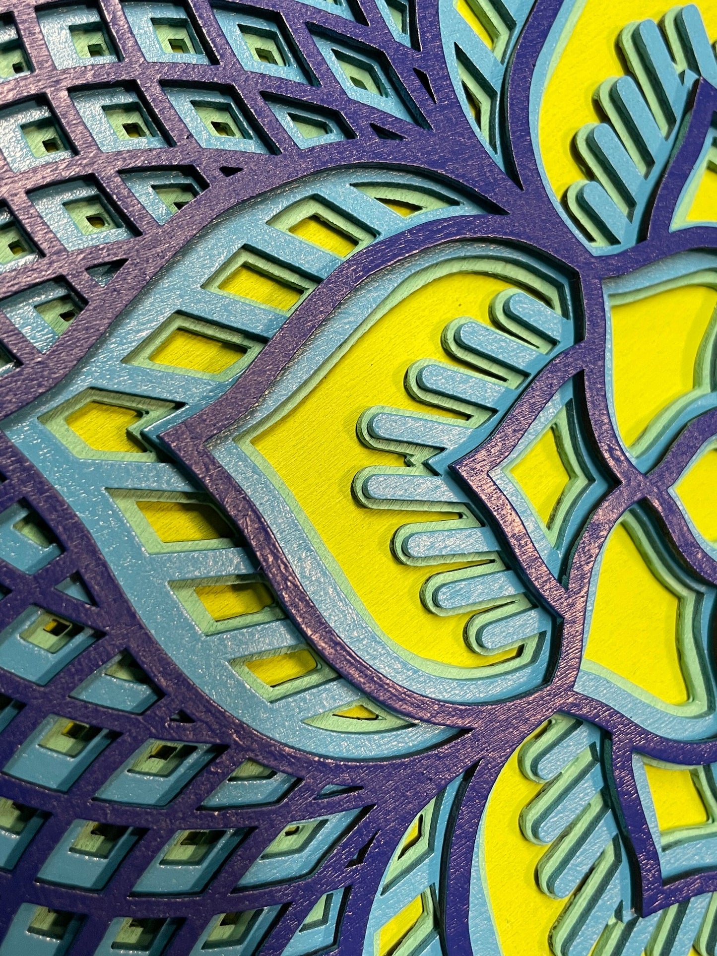 Rosette created with multiple laser cut layers, hand painted in blue and green hues. Also available as unpainted and unassembled.